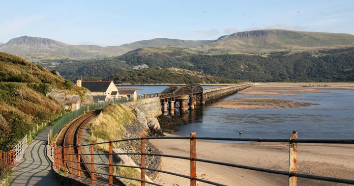 Barmouth Bridge over the River Mawddach estuary, Wales, UK