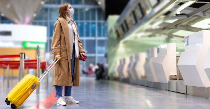 traveller with mask at the airport