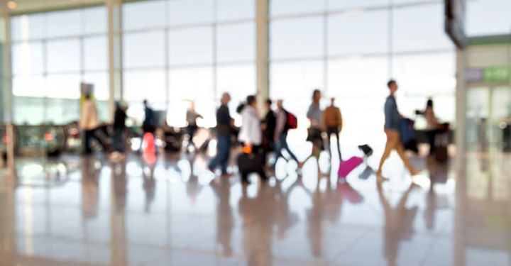 Passengers walking through Orlando International Airport