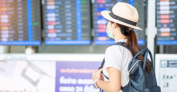traveller wearing mask at airport