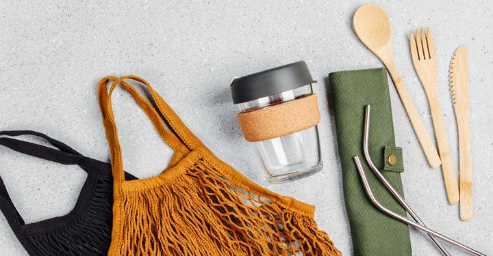 tote bags, reusable coffee cup, stainless steel straws and bamboo cutlery